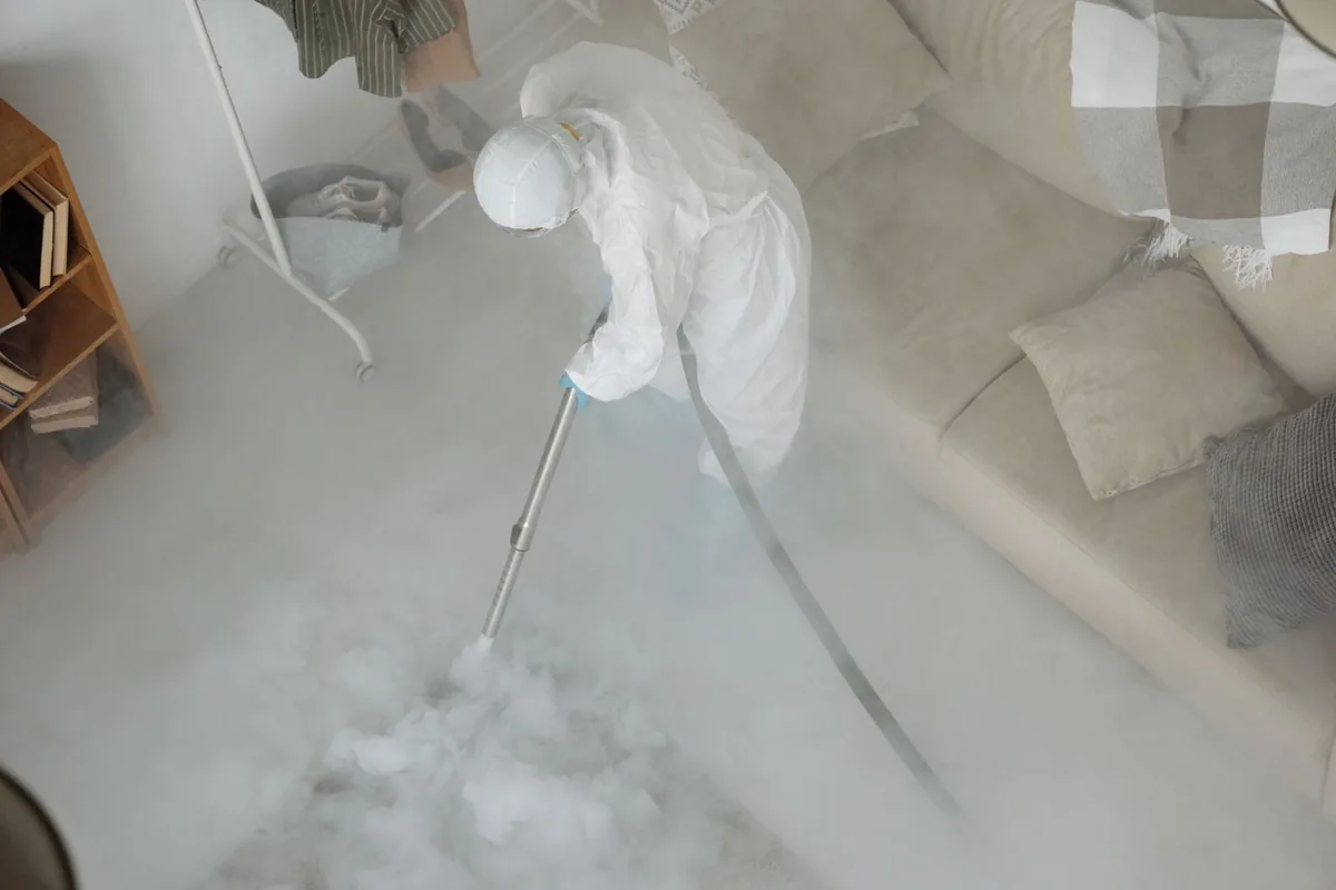 Biohazard cleanup technician in protective equipment, Gretna, LA